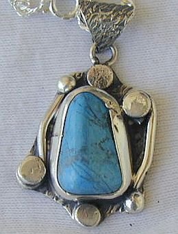 Turquoise pressed pendant