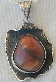 Reddish silver pendant