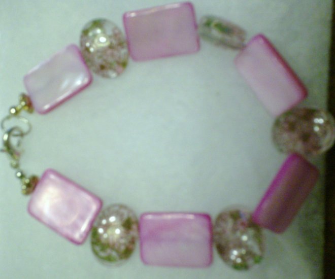 clear stone with pink flowers on it....