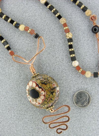 "Asymmetrical Underground Flower" necklace and earring set with polymer clay, gemstones and copper