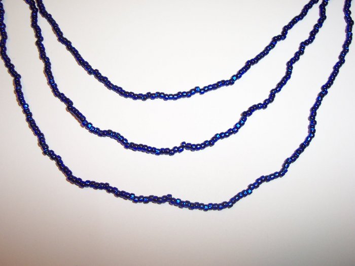 Electric Blue Triple strand necklace with earrings.