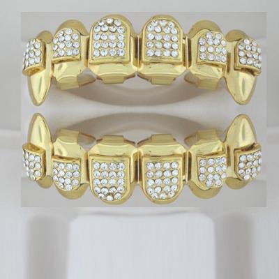Ninety-Four points of ice Dracula style golden playa grillz top and bottom combo