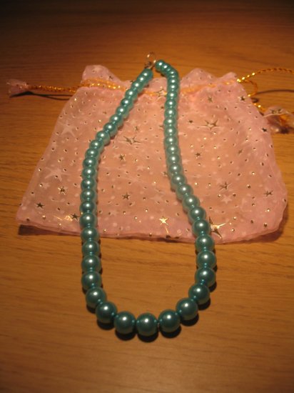 String of turquoise blue faux pearls