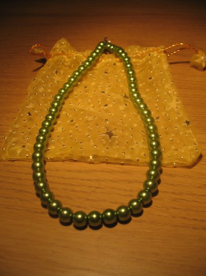 String of dark green faux pearls