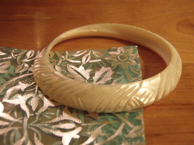 Carved shell bangle in white