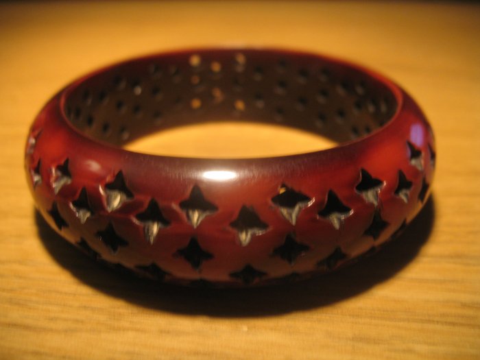 Brown resin bangle with 4-pointed star perforations