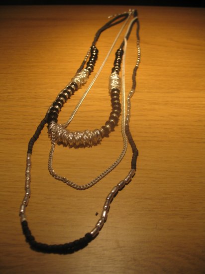 Black wood bead and silver tone metal bead tri-strand necklace