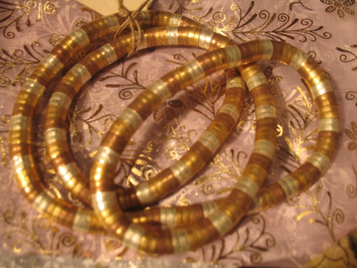 Twist metal necklace in gold, silver and copper