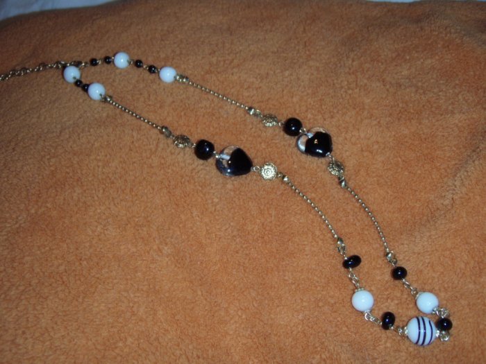 Black, white and gold glass, ceramic and metal bead necklace