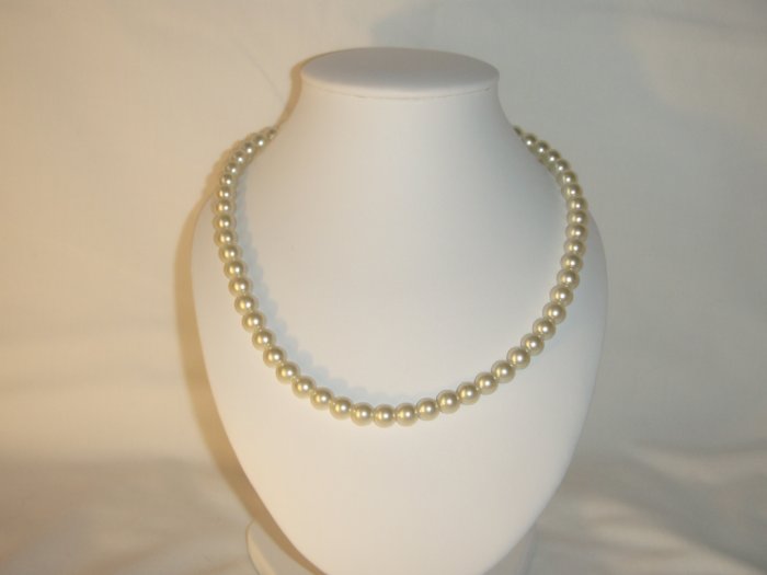 String of white faux pearls