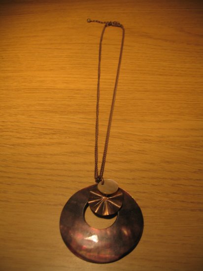 Brown shell medallion on brown chain (£10.00)