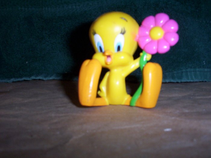 Adorable Tweety Bird Holding a Pink Daisy
