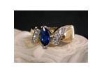 14KT gold HGE sapphire simulatedbypass ring, size 7 (fr-5)