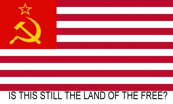 IS THIS STILL THE LAND OF THE FREE? T-SHIRT: Size L
