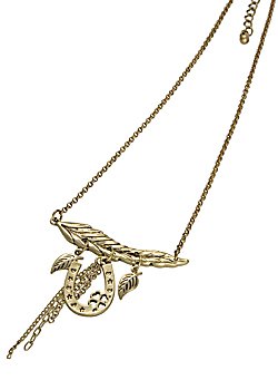 A gold plated leaf charm hangs from two golden chains