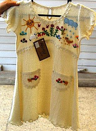 White baby dress from Ñusta, ekological pima cotton
