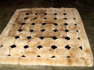 Light brown alpaca fur carpet with black rhombus designs, 300 x 280 cm