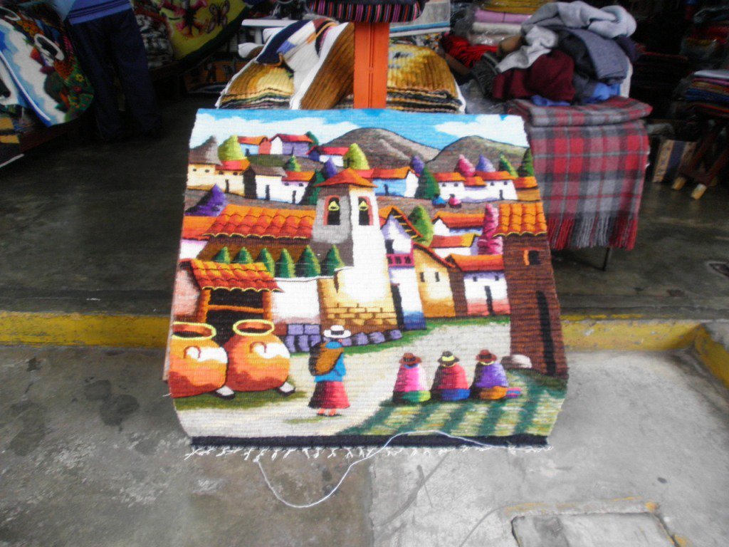 Traditionel hand weaved rug, peruvian women in a Village