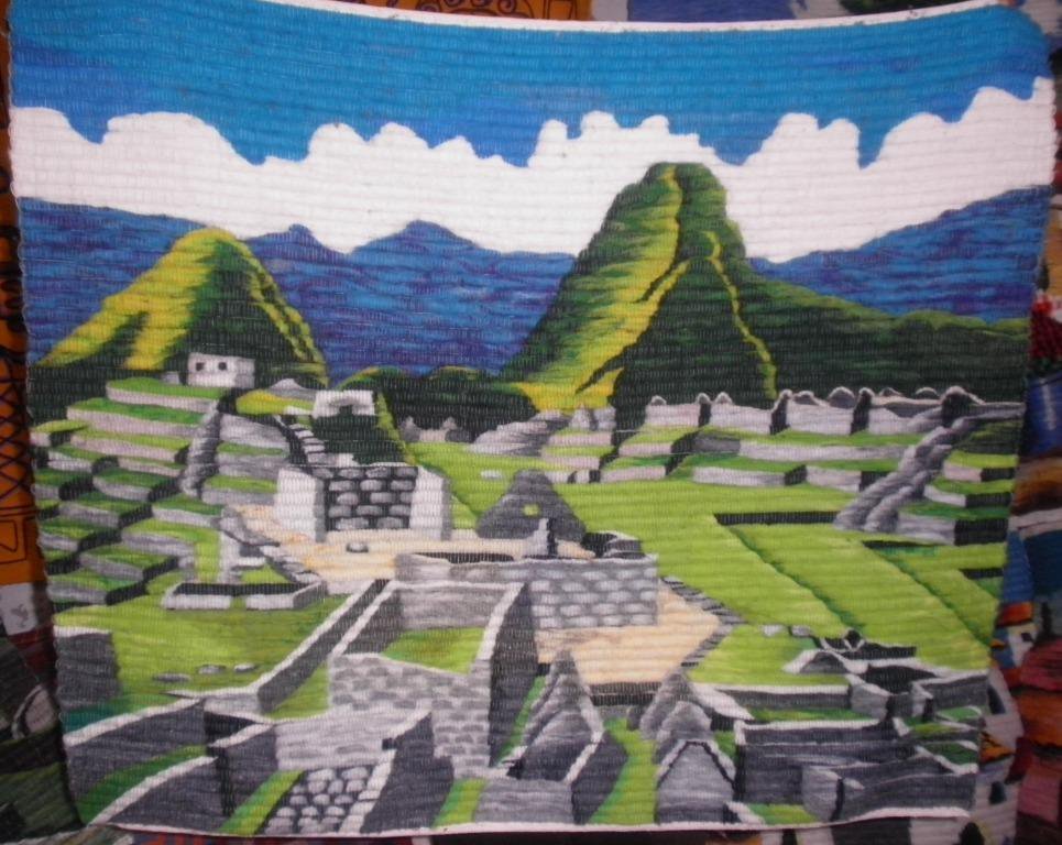 Traditionel peruvian hand weaved rug, ruins of Machu Picchu
