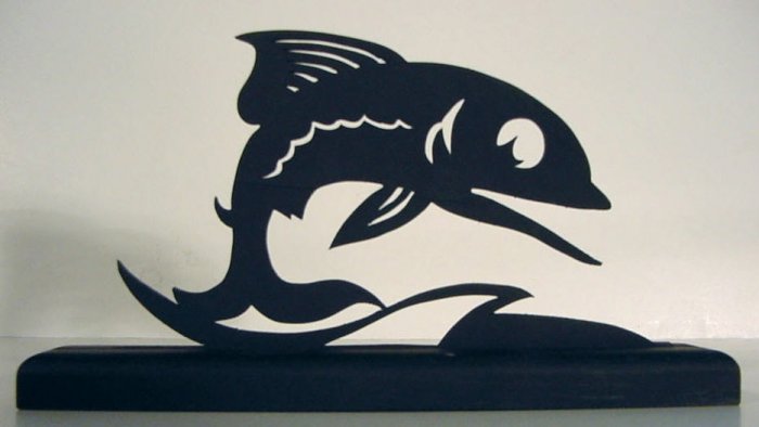 Fish leaping over the waves decorative silhouette.