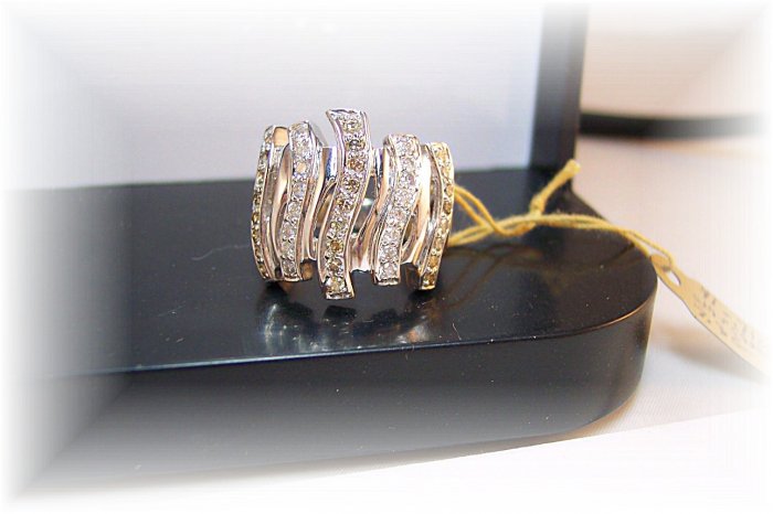 Columns of white and champagne diamonds. Big presence. 18k right hand ring