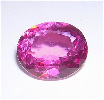 5.97Ct. Flamingo Mystic Topaz 12 x 10mm Oval cut gem eye clean