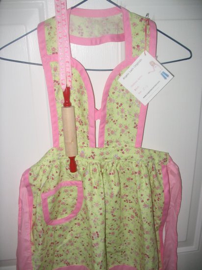 Lime green and pink children's apron with rolling pin
