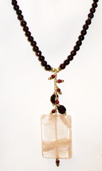 NK034 Rose Quartz Pendant in a Garnet Strand. Sterling Silver Beads and Clasps