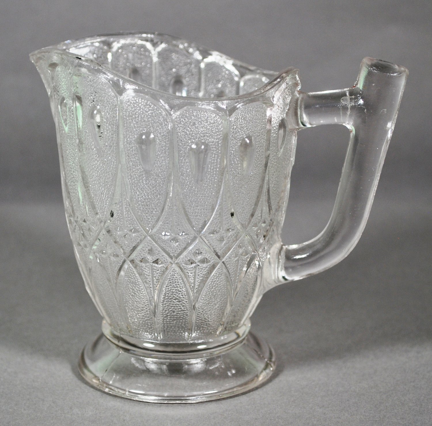 Early American Pressed Glass Stippled Double Loop Crystal Creamer