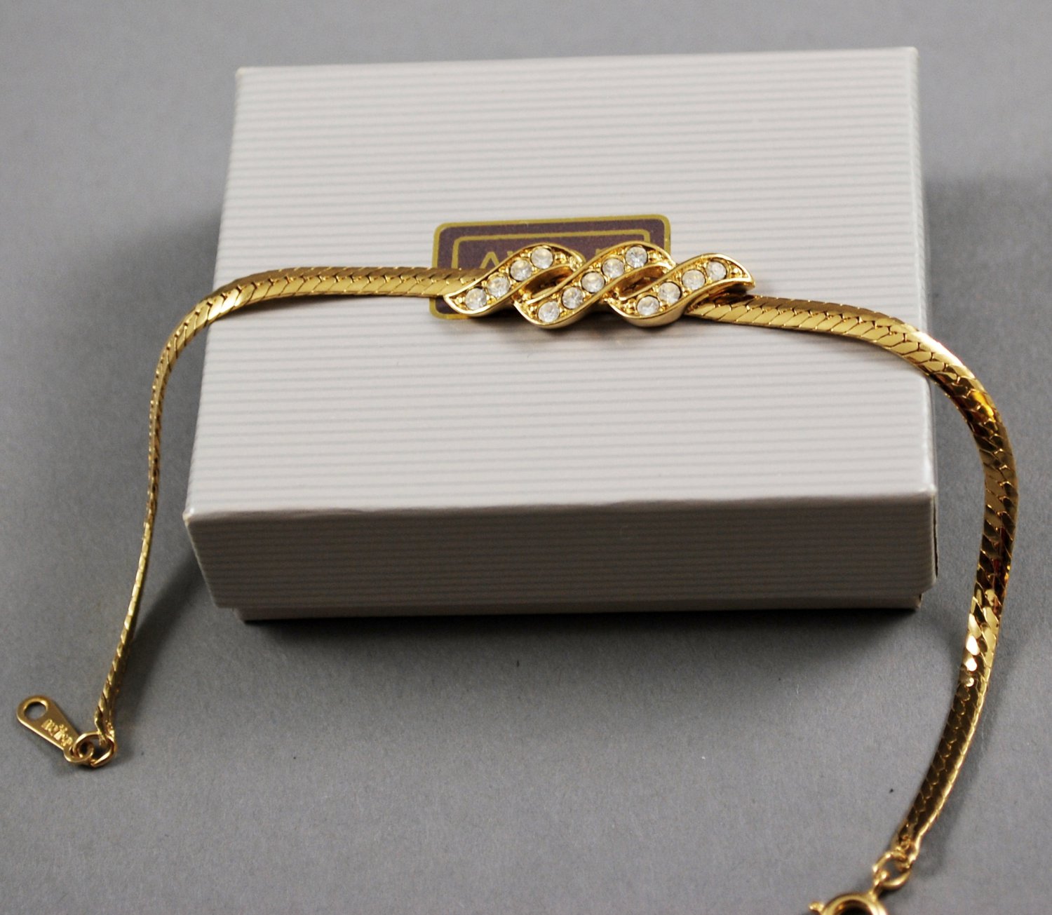 Avon 1986 Sparkle Twist Bracelet Clear Rhinestones Gold Tone Setting
