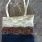 Crocheted purse in brown black and cream color