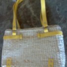 Straw purse with faux leather yellow straps