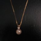 Like new cultured pearl pendant in 14K gold with diamond accents