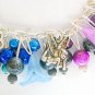 Fairy and four leaf clover rainbow black bead charm bracelet