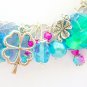 Four leaf clover aqua fuchsia pink iridescent charm bracelet