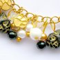 Czech black cat head bead gold paw print charm bracelet