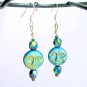 Iridescent black aqua AB Czech glass full moon face bead earrings