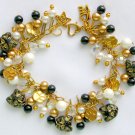 Czech black cat head bead gold paw print charm bracelet