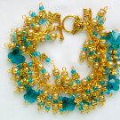 Aqua blue crystal butterfly gold flower cha cha bracelet Aqua blue crystal butterfly gold flower cha cha bracelet