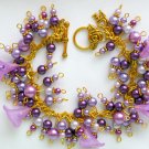 Purple trumpet flower glass pearl bead gold cha cha bracelet