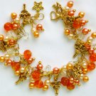 Fairy girl orange glass pearl bead cha cha charm bracelet