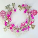 White cat milkglass bead and paw flower bright pink charm bracelet White cat milkglass bead and paw flower bright pink charm bracelet