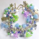 Cat and flower pastel light blue purple green charm bracelet Cat and flower pastel light blue purple green charm bracelet