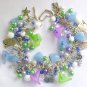 Cat and flower pastel light blue purple green charm bracelet