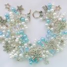 Snowflake and stars light ice blue bead charm bracelet Snowflake and stars light ice blue bead charm bracelet