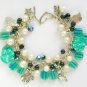 Cat and aw teal green AB black white bead charm bracelet