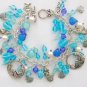 Mermaid fish Czech seashell bead aqua and blue charm bracelet