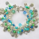 Mermaid Czech sea shell bead fish dolphin aqua green charm bracelet Mermaid Czech sea shell bead fish dolphin aqua green charm bracelet