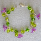 Purple bell flower bead peridot green bicone bracelet earrings set Purple bell flower bead peridot green bicone bracelet earrings set