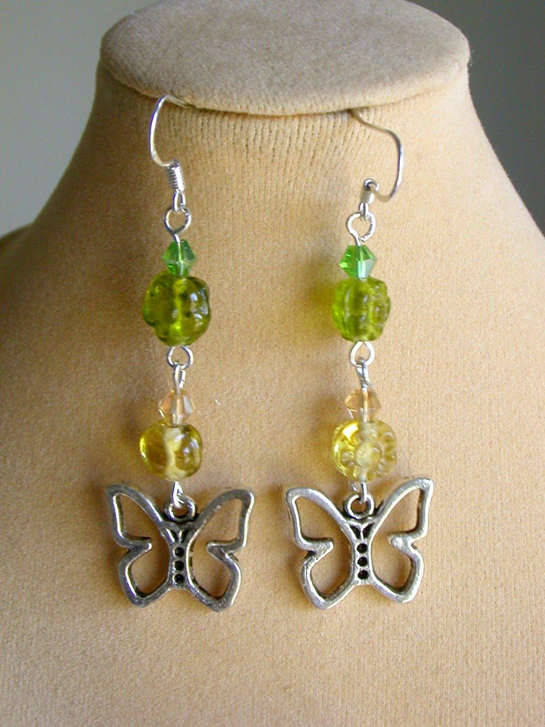 Butterfly charm green yellow pressed glass flower bead earrings